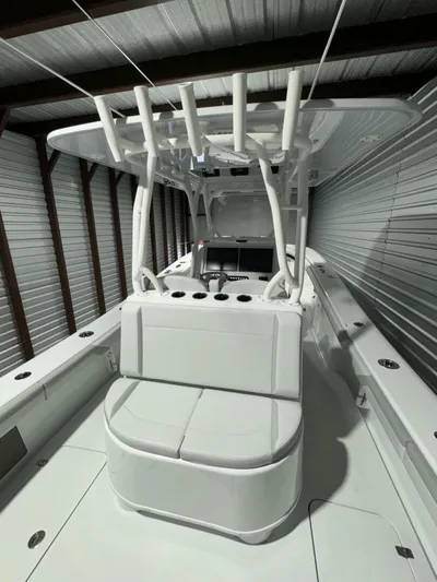 36 Yellowfin Yacht Photos Pics 2024 Yellowfin 36 boat in storage, featuring sleek white design and spacious seating.