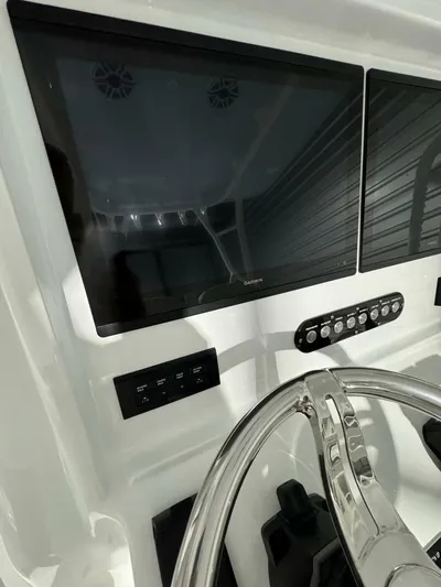 36 Yellowfin Yacht Photos Pics 2024 Yellowfin 36 boat dashboard with modern controls and steering wheel.