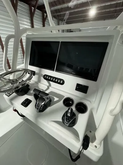 36 Yellowfin Yacht Photos Pics 2024 Yellowfin 36 boat dashboard with dual screens and modern controls.