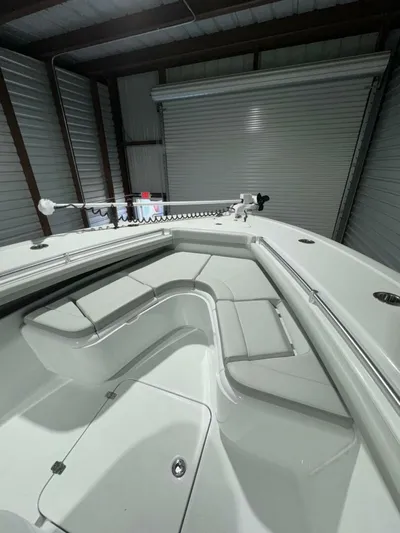 36 Yellowfin Yacht Photos Pics 2024 Yellowfin 36 boat interior with sleek seating and storage in a garage setting.