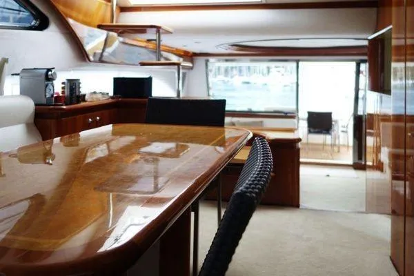 Golden Ex Yacht Photos Pics Luxurious interior of a 2001 Ferretti Yachts 680, featuring elegant wood finishes and spacious layout.
