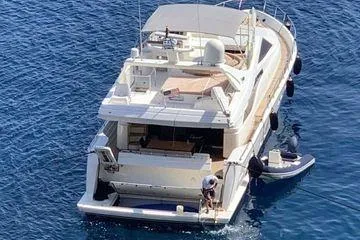 Golden Ex Yacht Photos Pics 2001 Ferretti Yachts 680 on blue water, aerial view.
