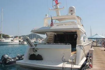 Golden Ex Yacht Photos Pics 2001 Ferretti Yachts 680 docked at a marina, rear view.