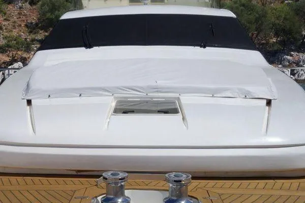 Golden Ex Yacht Photos Pics 2001 Ferretti Yachts 680, front deck view with covered windshield and winches.