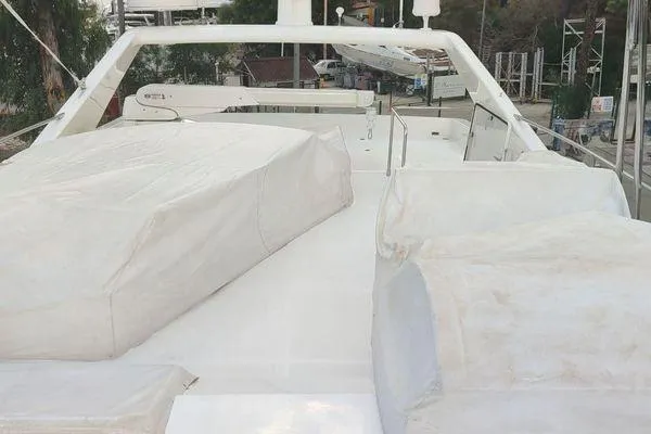 Golden Ex Yacht Photos Pics Flybridge of 2001 Ferretti Yachts 680, covered and docked, showcasing spacious design.
