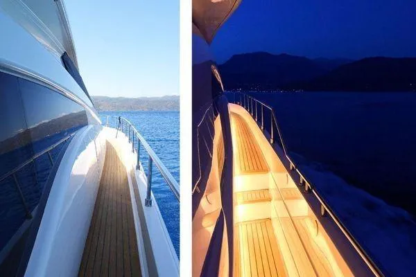 Golden Ex Yacht Photos Pics Side view of 2001 Ferretti Yachts 680 during day and illuminated at night.