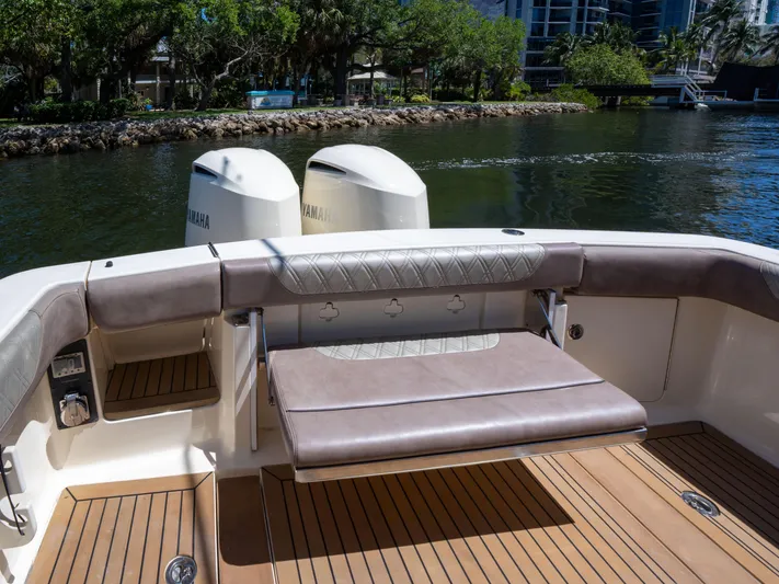  Yacht Photos Pics 2015 Scout 320 LFX boat with Yamaha engines, featuring a spacious deck and comfortable seating.