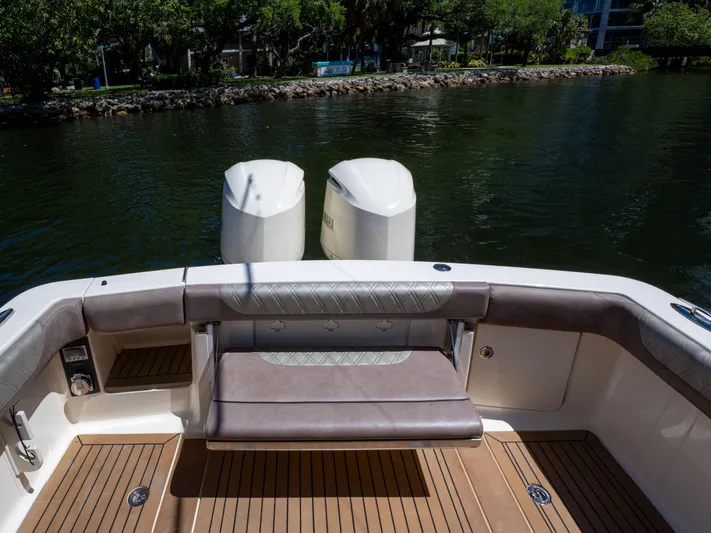  Yacht Photos Pics 2015 Scout 320 LFX boat with dual engines, featuring a spacious deck and comfortable seating.