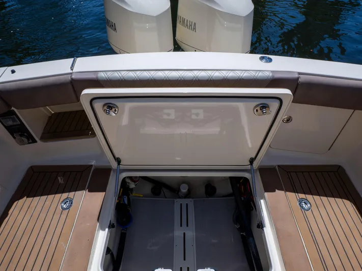  Yacht Photos Pics 2015 Scout 320 LFX boat with open storage compartment and Yamaha engines.