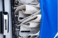 Rolled sails on a Custom Patago 40 boat, 2019 model, with blue cover.