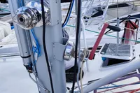 Close-up of a 2019 Custom Patago 40 sailboat mast with rigging and winches.