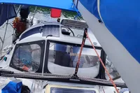Custom Patago 40 sailboat cockpit with solar panels, blue canopy, and nautical equipment, 2019 model.