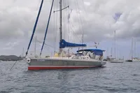 Sailboat "Patago 40" anchored in a calm bay under cloudy skies, 2019 model.