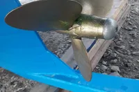 Propeller of 2019 Custom Patago 40 boat on gravel surface.