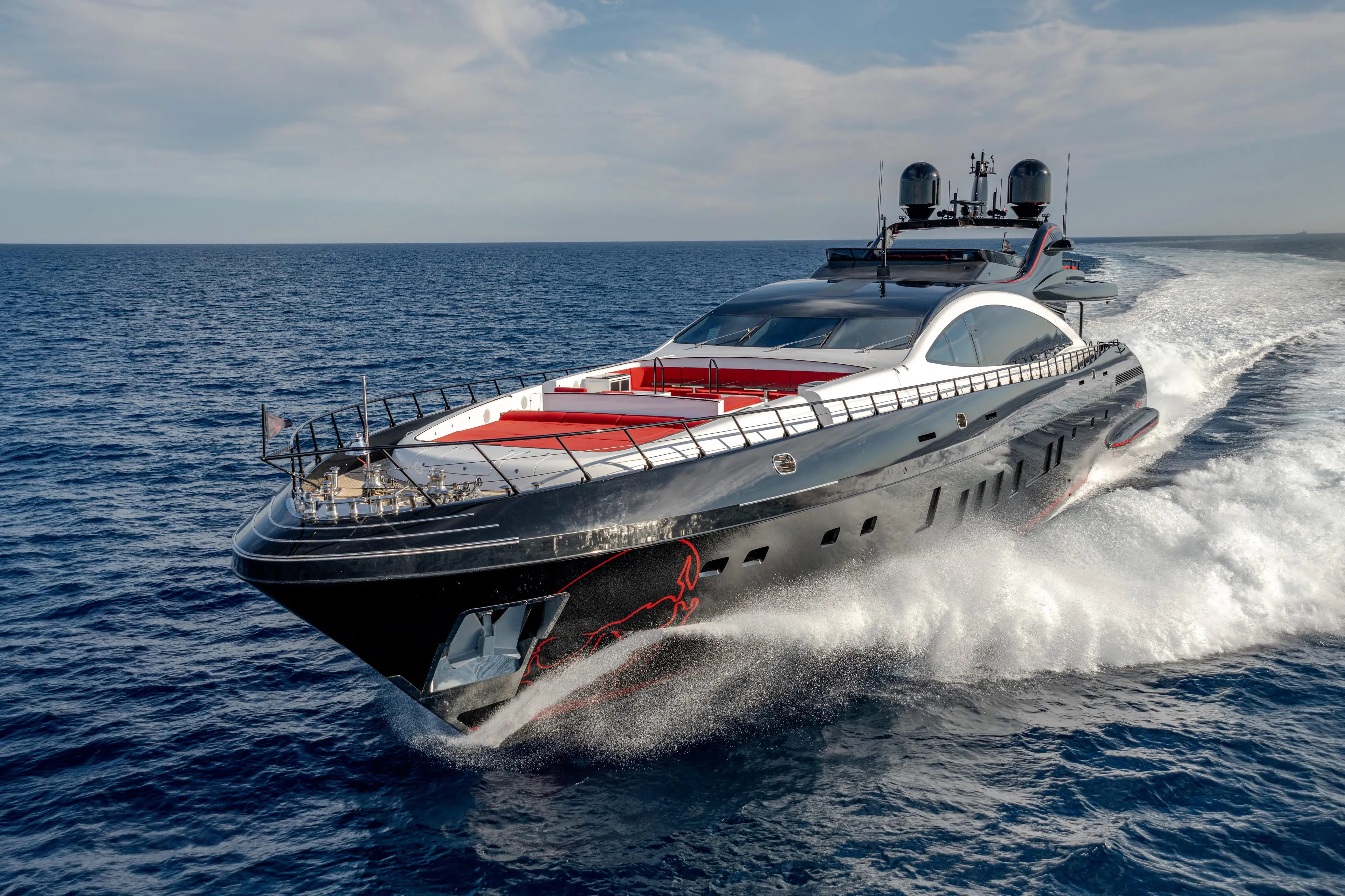 Black Legend Yacht Photos Pics Luxurious 2017 Mangusta 165E yacht cruising on open sea under clear skies.