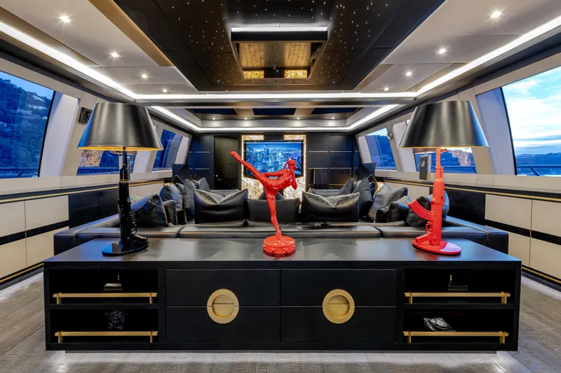 Black Legend Yacht Photos Pics Luxurious interior of 2017 Mangusta MANGUSTA 165E yacht with modern decor and ambient lighting.