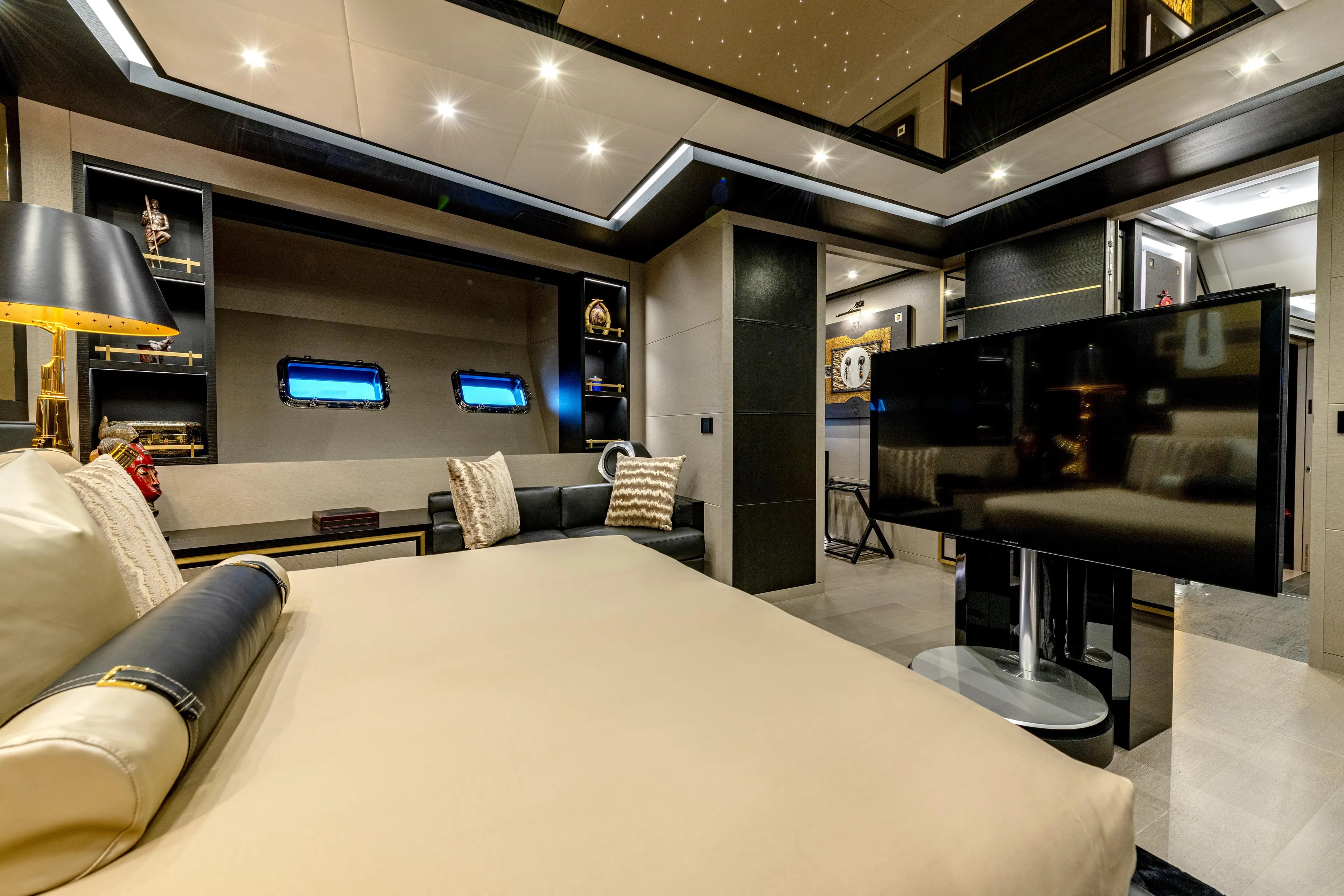 Black Legend Yacht Photos Pics Luxurious interior of 2017 Mangusta 165E yacht with modern decor and entertainment system.