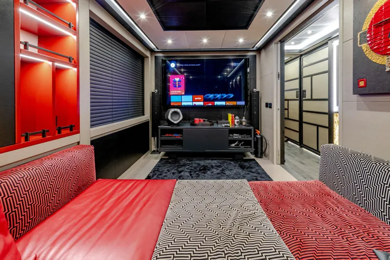 Black Legend Yacht Photos Pics Luxurious Mangusta 165E 2017 yacht interior with modern entertainment system and stylish seating.