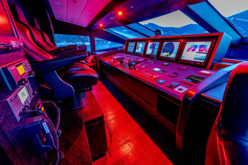 Black Legend Yacht Photos Pics Control room of 2017 Mangusta MANGUSTA 165E yacht with illuminated dashboard and seating.