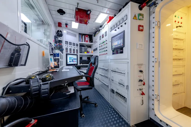 Black Legend Yacht Photos Pics Control room of 2017 Mangusta 165E yacht with advanced monitoring systems and equipment.