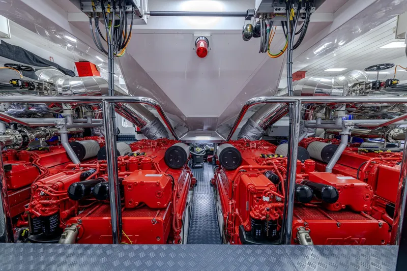 Black Legend Yacht Photos Pics Engine room of 2017 Mangusta MANGUSTA 165E yacht with red machinery.