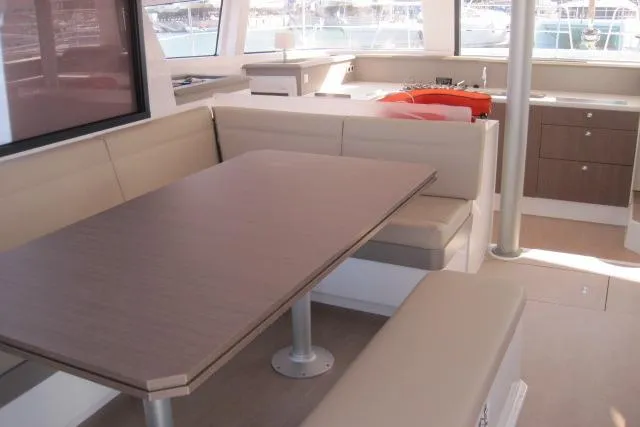  Yacht Photos Pics Modern interior of 2020 Bali 4.3 catamaran with dining area and kitchenette.