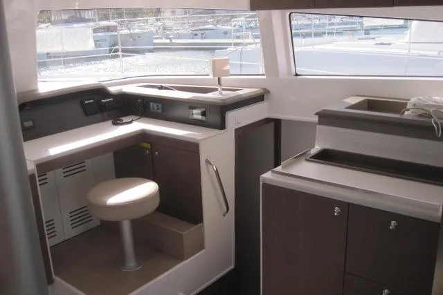  Yacht Photos Pics Interior of a 2020 Bali 4.3 catamaran with modern navigation station and seating.