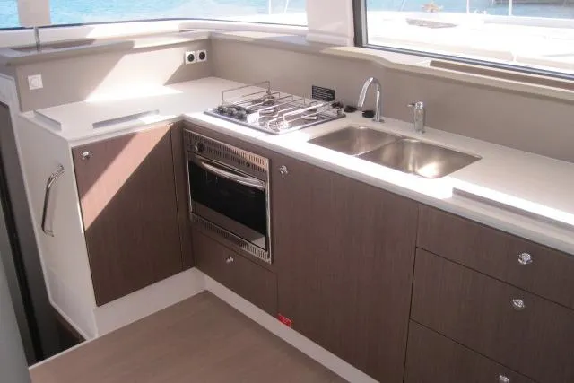  Yacht Photos Pics Modern kitchen interior on 2020 Bali 4.3 yacht with stove, sink, and oven.