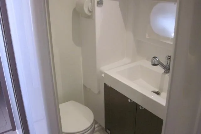  Yacht Photos Pics Compact bathroom in a 2020 Bali 4.3 model, featuring a sink and toilet.