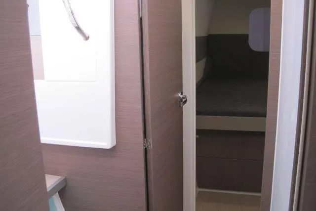  Yacht Photos Pics Interior of a 2020 Bali 4.3 yacht showing a cabin and bathroom.