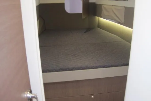  Yacht Photos Pics Cozy cabin interior of 2020 Bali 4.3 yacht with a comfortable bed.