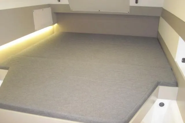  Yacht Photos Pics Interior cabin of 2020 Bali 4.3, featuring a spacious bed with ambient lighting.