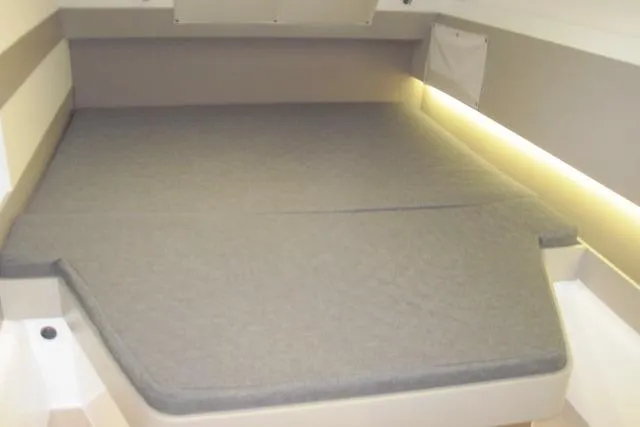  Yacht Photos Pics Cozy cabin bed in 2020 Bali 4.3 yacht with soft lighting and gray bedding.