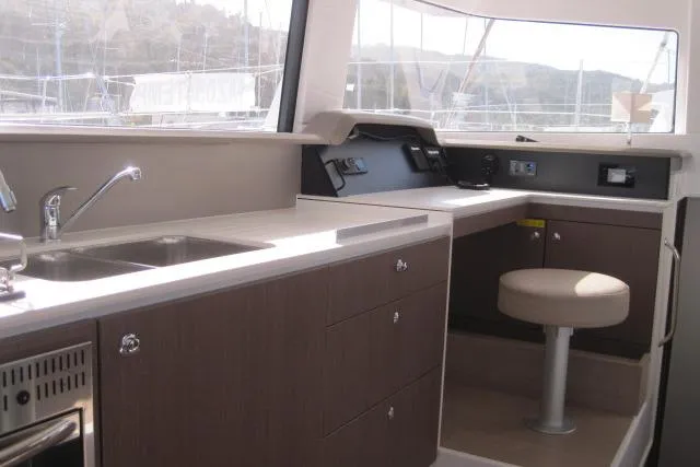  Yacht Photos Pics Interior of 2020 Bali 4.3 yacht with modern kitchen and seating area.