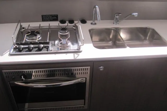  Yacht Photos Pics Modern kitchen in 2020 Bali 4.3 yacht with stove, oven, and double sink.