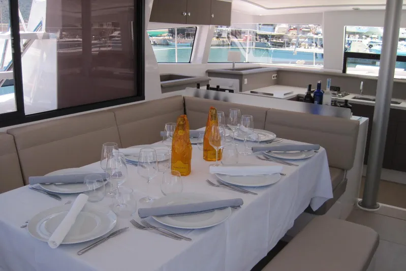  Yacht Photos Pics Luxurious dining area on a 2020 Bali 4.3 yacht, elegantly set with tableware.