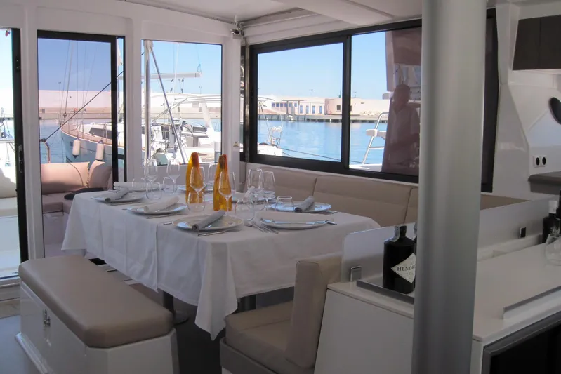  Yacht Photos Pics Luxurious dining area on a 2020 Bali 4.3 catamaran, elegantly set with tableware.