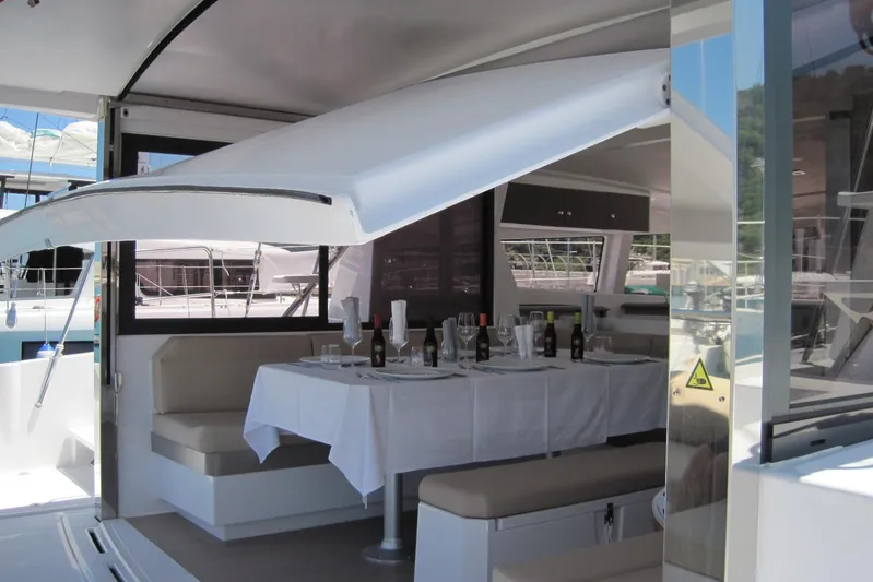  Yacht Photos Pics Luxurious 2020 Bali 4.3 catamaran with elegant dining setup on deck.