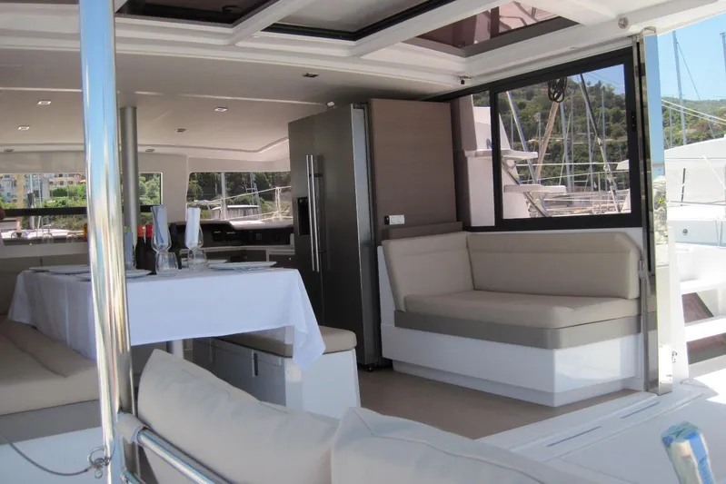  Yacht Photos Pics Luxurious interior of 2020 Bali 4.3 catamaran with dining area and modern furnishings.