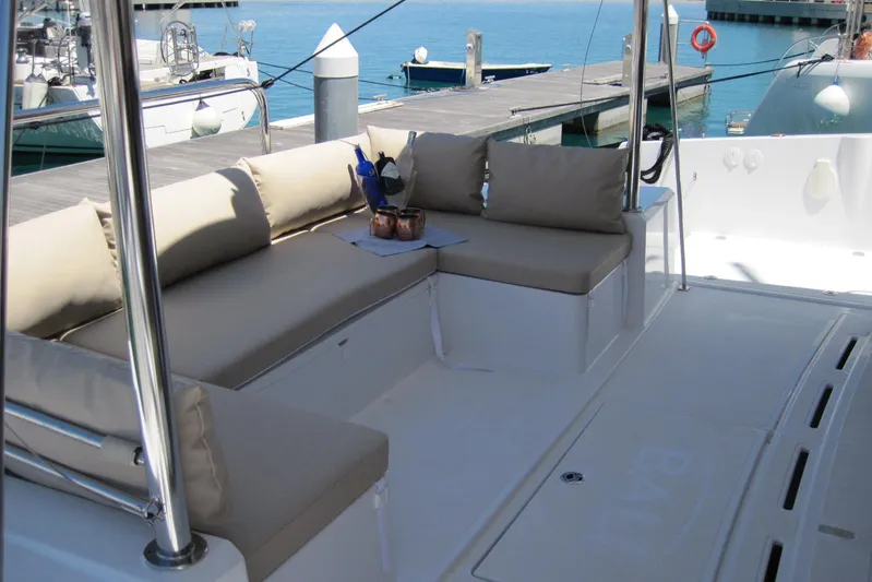  Yacht Photos Pics Luxurious seating area on a 2020 Bali 4.3 yacht docked at a marina.