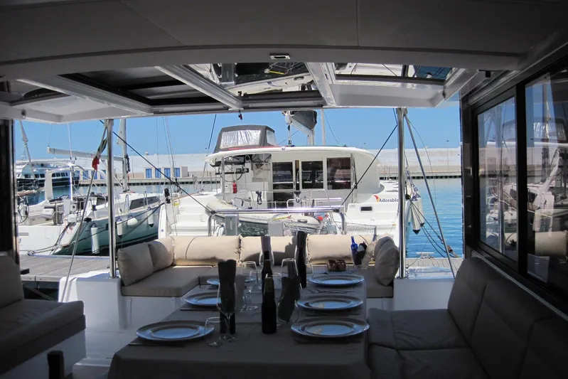  Yacht Photos Pics Luxurious Bali 4.3 catamaran interior with dining setup, docked at marina, 2020 model.