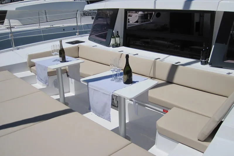  Yacht Photos Pics Luxurious seating area on 2020 Bali 4.3 yacht with champagne and glasses.