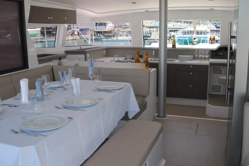  Yacht Photos Pics Luxurious interior of 2020 Bali 4.3 catamaran with elegant dining setup.