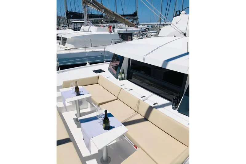  Yacht Photos Pics Luxurious Bali 4.3 catamaran deck with seating, tables, and wine bottles, 2020 model.