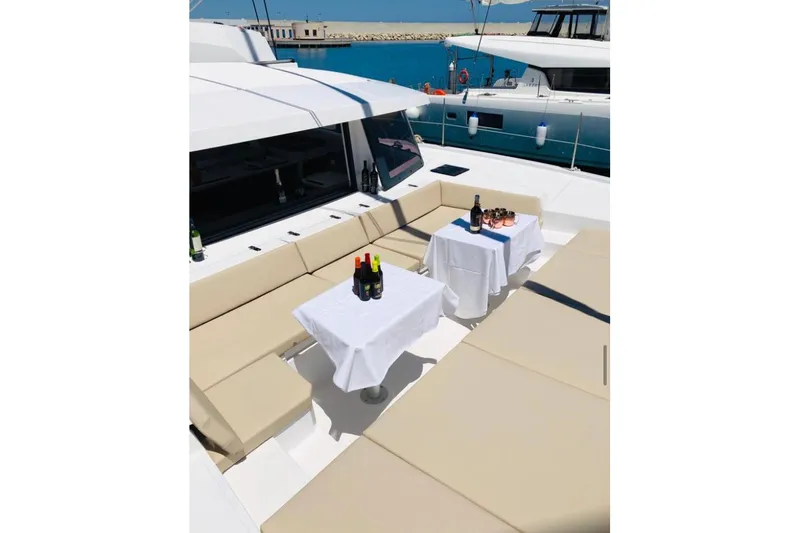  Yacht Photos Pics Luxurious Bali 4.3 yacht deck with tables, drinks, and seating, 2020 model.