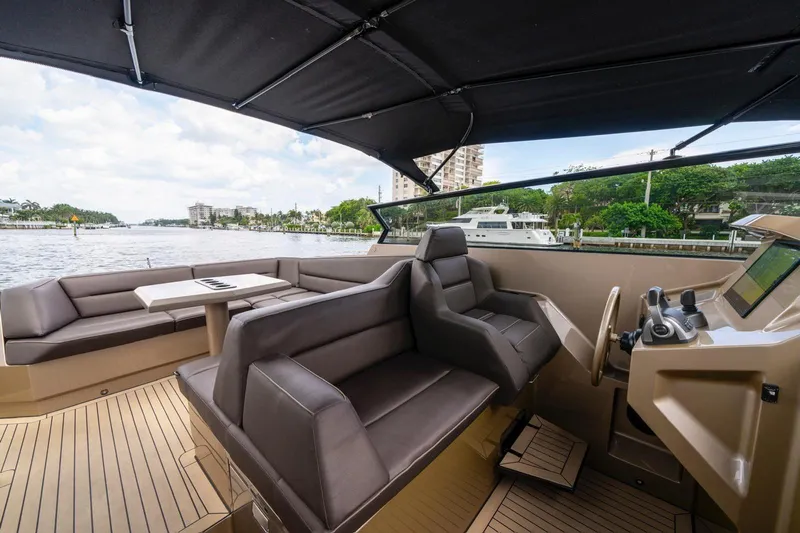 Cobra Yacht Photos Pics Luxurious 2022 Vanquish Yachts VQ45 interior with sleek seating and modern helm.