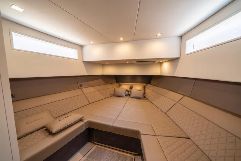 Cobra Yacht Photos Pics Luxurious interior of 2022 Vanquish Yachts VQ45 with elegant seating and ambient lighting.
