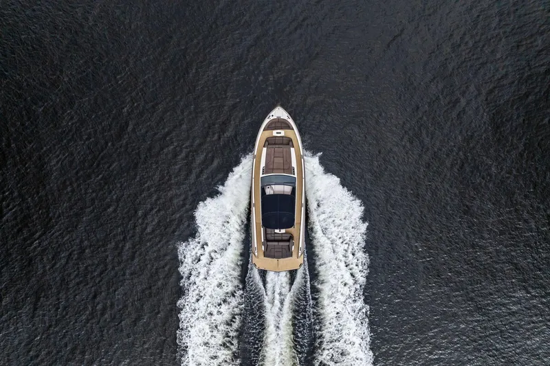 Cobra Yacht Photos Pics Aerial view of 2022 Vanquish Yachts VQ45 cruising on open water.