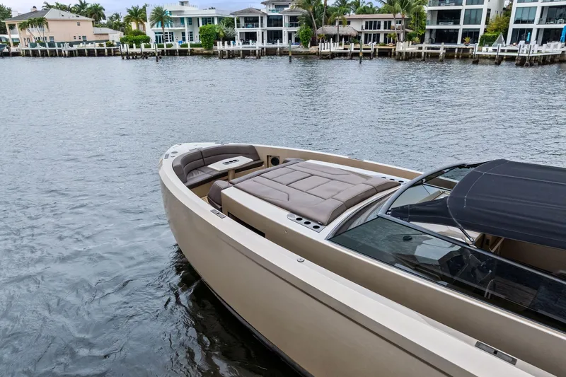 Cobra Yacht Photos Pics 2022 Vanquish Yachts VQ45 luxury boat docked near waterfront homes.