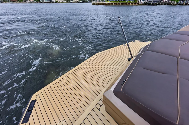 Cobra Yacht Photos Pics Luxury Vanquish Yachts VQ45 deck, 2022 model, overlooking serene water.